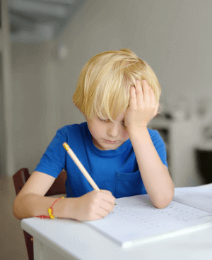 Frustrated child doing homework