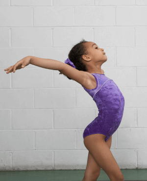 Young girl doing gymnastics pose