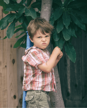 Young child showing his angry face