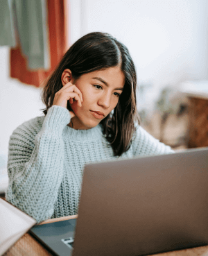 Women sitting in front of laptop during her virtual therapy session