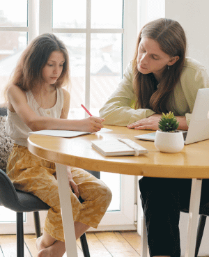 Parent helping child with homework to improve executive function skills.