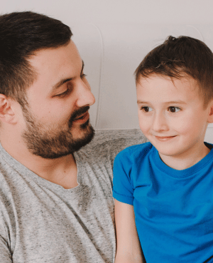 Parent and child in conversation, representing nonviolent communication for parents and secure attachment.