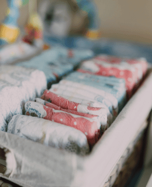 Stack of nighttime pull-ups, representing nighttime potty training, bedwetting, and developmental readiness.